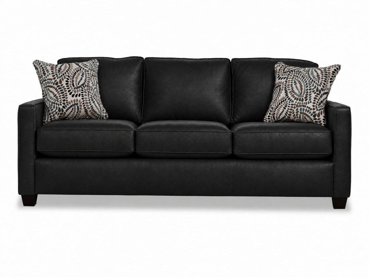 City Leather Sofa - Black front view with three cushioned seats and backs, slim track arms, dark wood legs and two patterned accent pillows