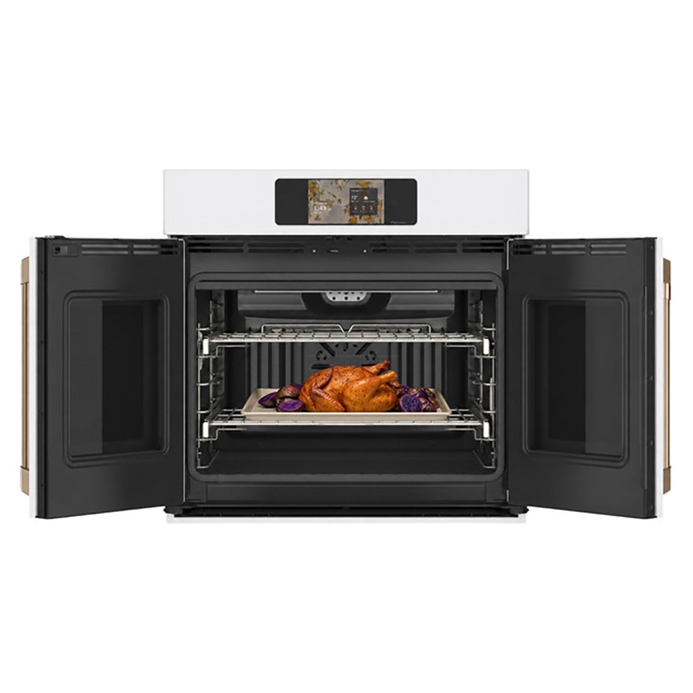 CAFÉ™ Professional Series 30" Matte White French-Door Wall Oven open with roasting trays on two racks