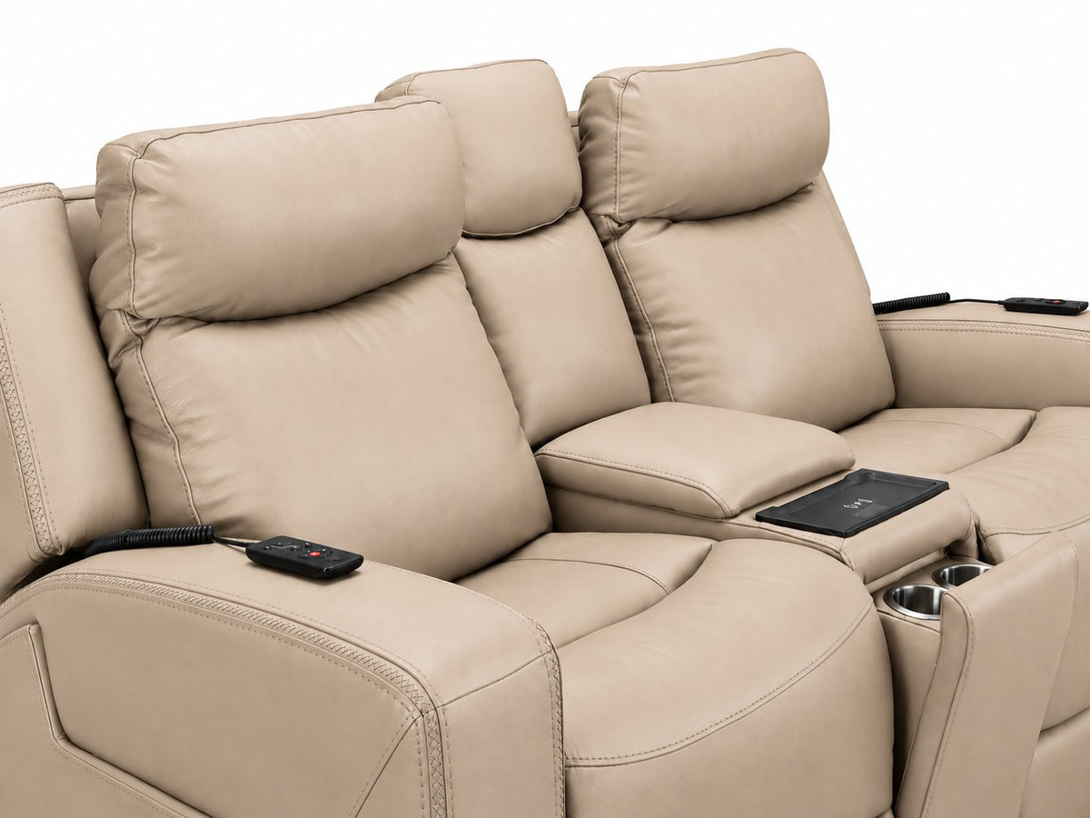 Jackson pristine leather loveseat close-up showing padded seats, remotes, wireless charging pad and cupholders
