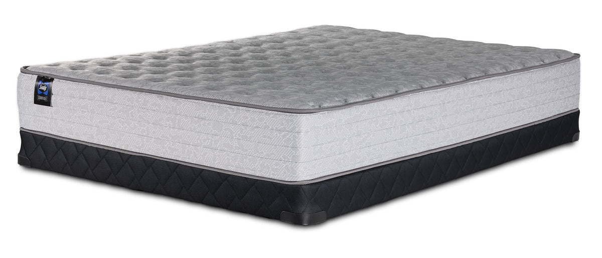 Sealy Burchelle Extra Firm Tight Top Queen mattress with black low profile boxspring, three-quarter view