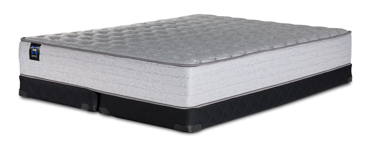 Sealy Burchelle Extra Firm Tight Top Queen mattress with black low profile split boxsprings, three-quarter view