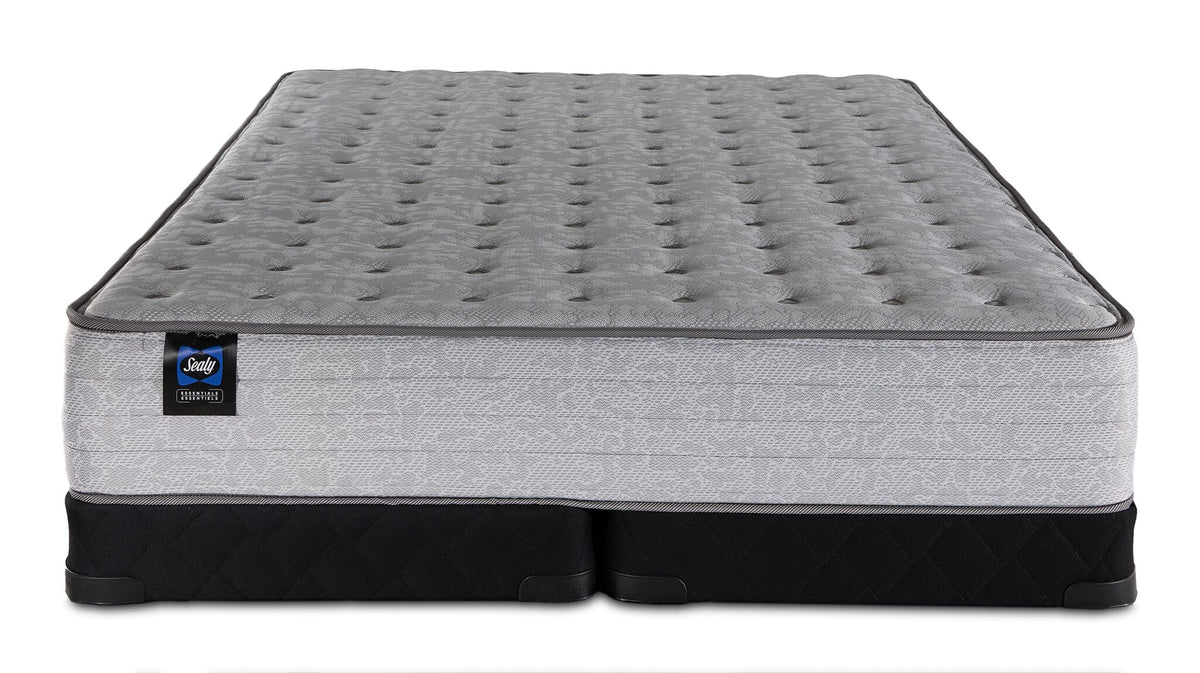 Sealy Burchelle Extra Firm Tight Top Queen mattress with black low profile split boxsprings, front view