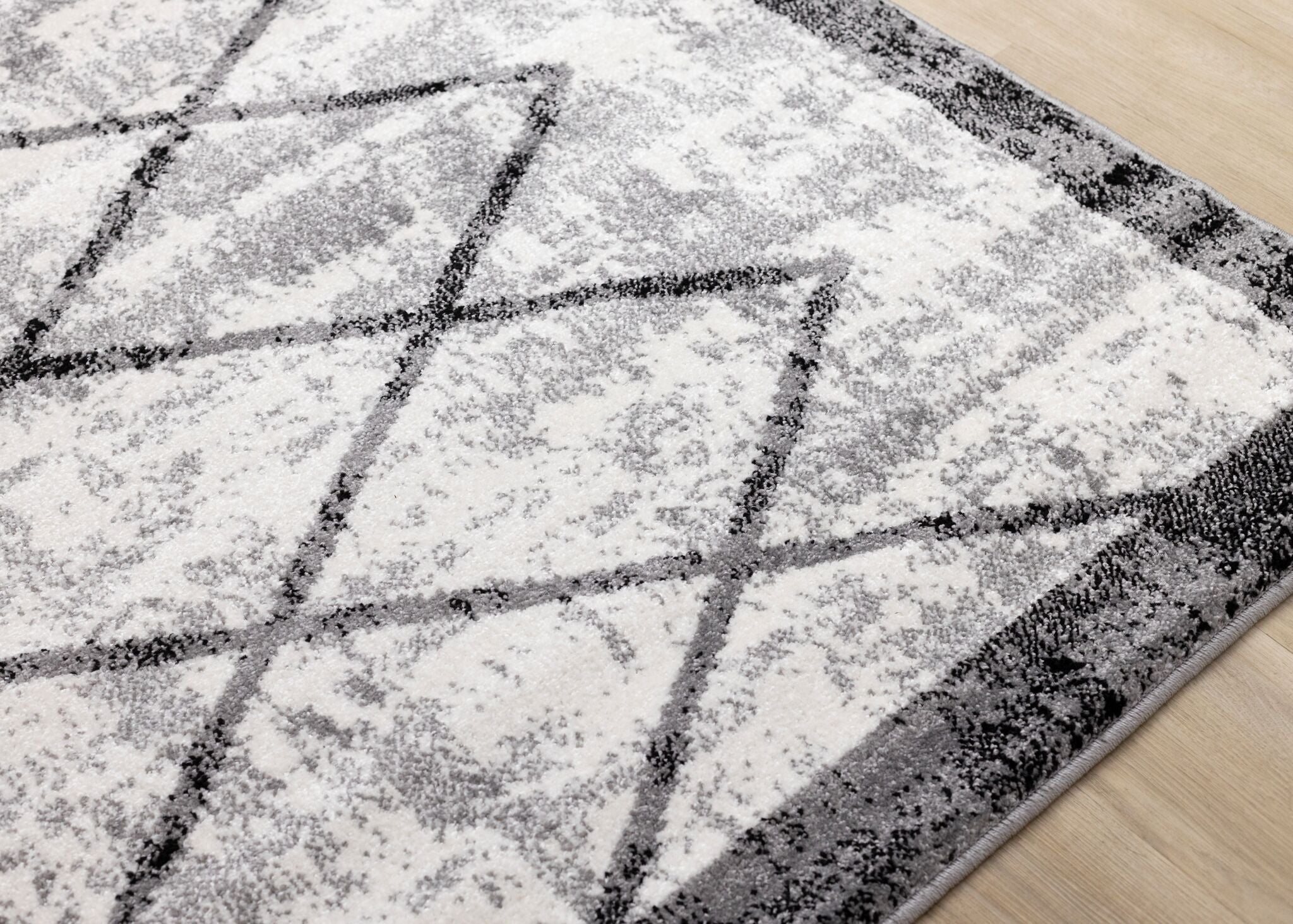 Ashwood 5'3" x 7'7" Distressed Lattice Area Rug - Grey, Black, White