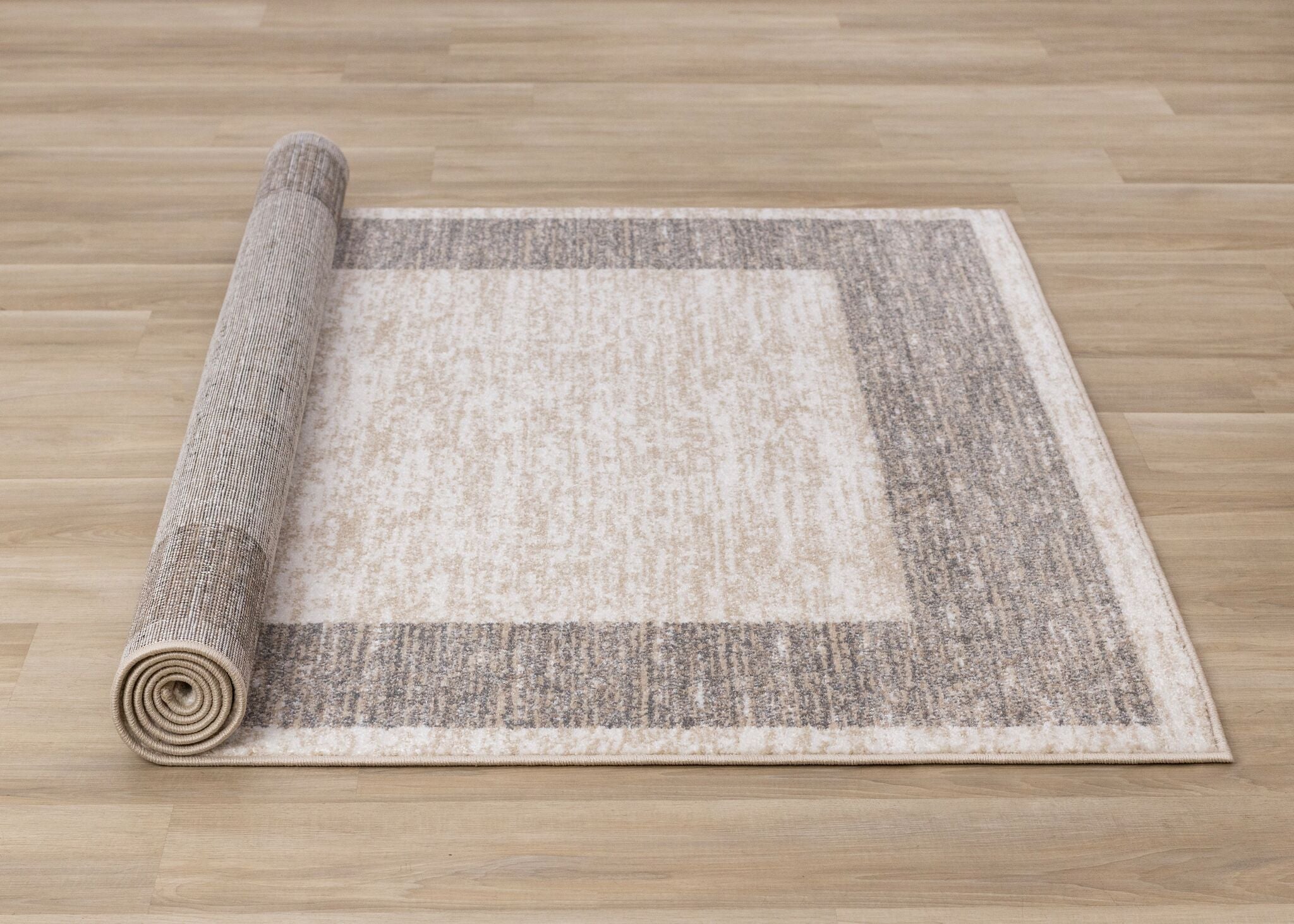 Earthly Essence 6'7" x 9'10" Distressed Border Area Rug - Taupe