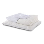 Twin 7-Piece Cool Touch White Dream Bedding Bundle with white pillows, folded bedding essentials and sleep mask