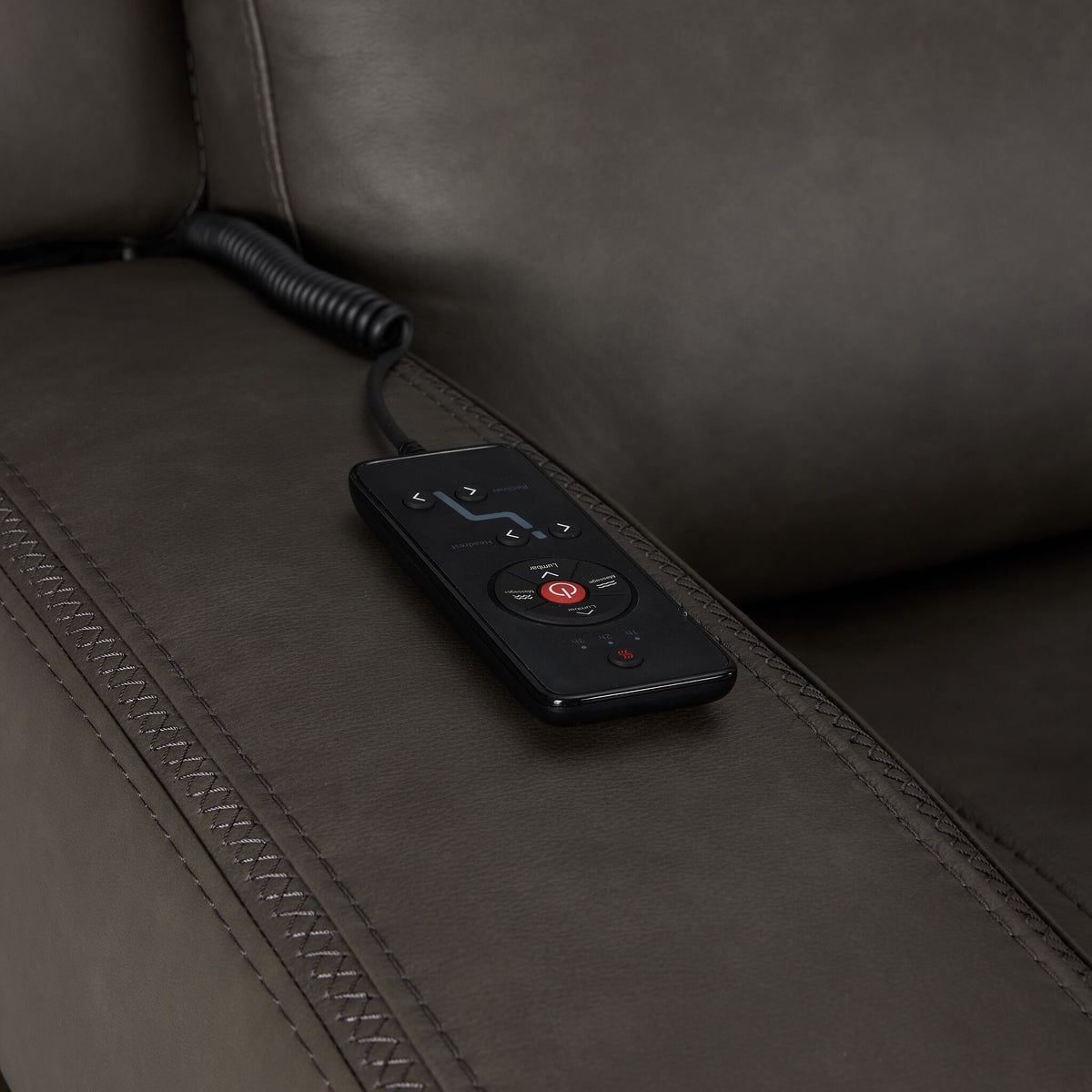 Jackson anthracite leather seating close-up showing wired remote for power recline, heat and massage controls