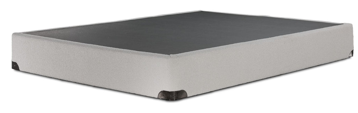 Kingsdown White Boucle twin boxspring with beige polyester upholstery and a black support surface, angled view