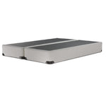 Angled view of the Kingsdown White Boucle queen split boxspring with two matching beige foundation pieces