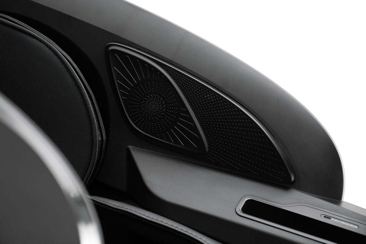 L2 Zen Elite Massage Chair close-up showing the built-in side speaker grille and armrest storage area