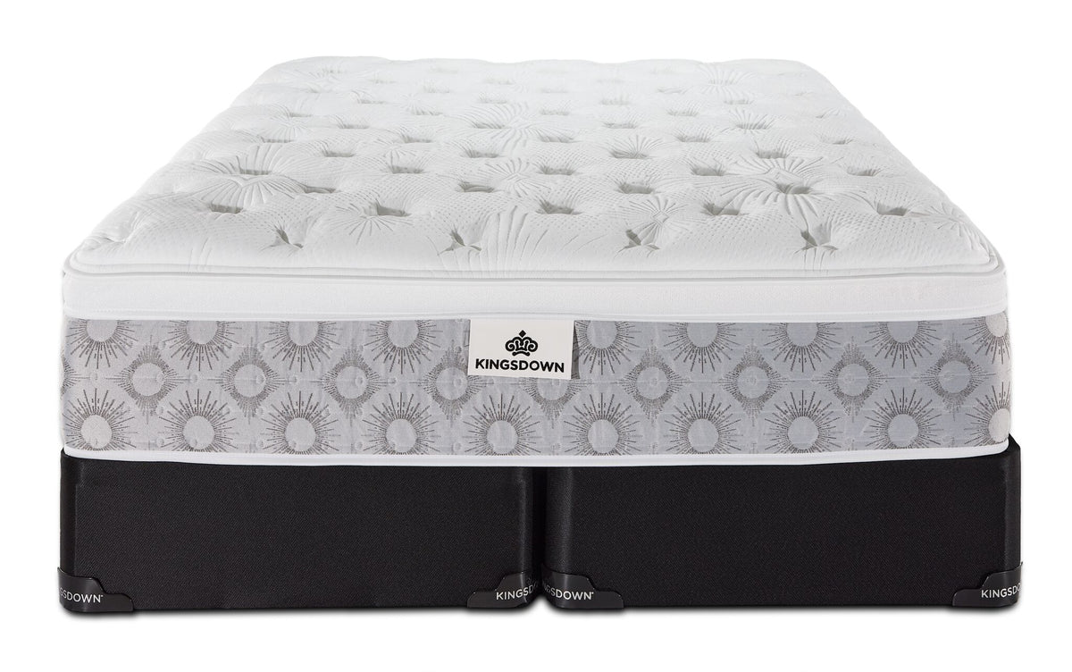 Front view of the Kingsdown Quinlan Plush Euro Top queen mattress with two black split boxsprings