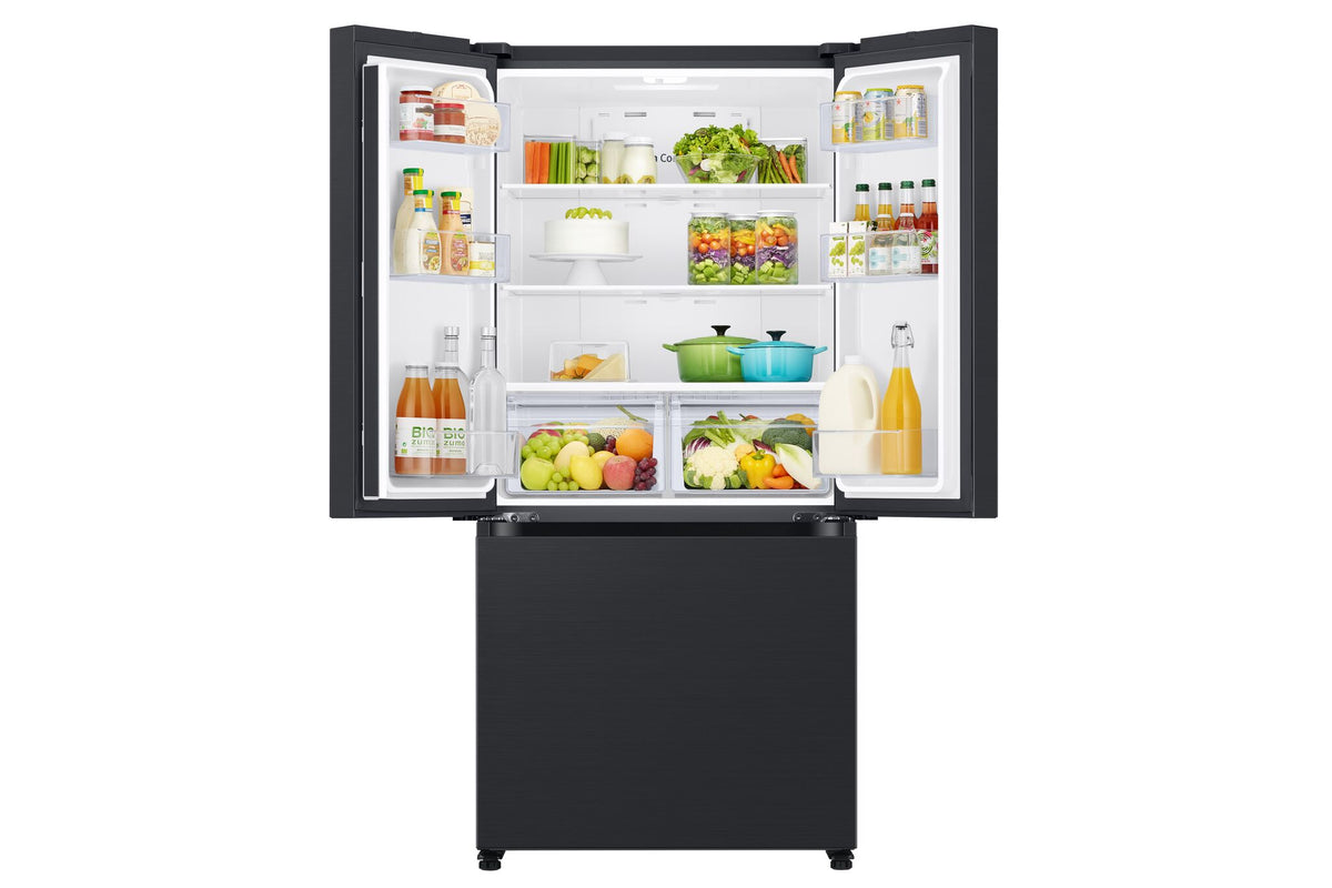 Samsung 33" French door refrigerator open view stocked with food across shelves, door bins and crisper drawers