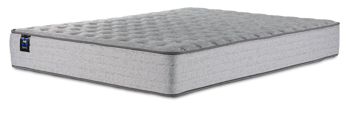 Sealy Burchelle Extra Firm Tight Top Full mattress with grey quilted top and patterned side panels, three-quarter view