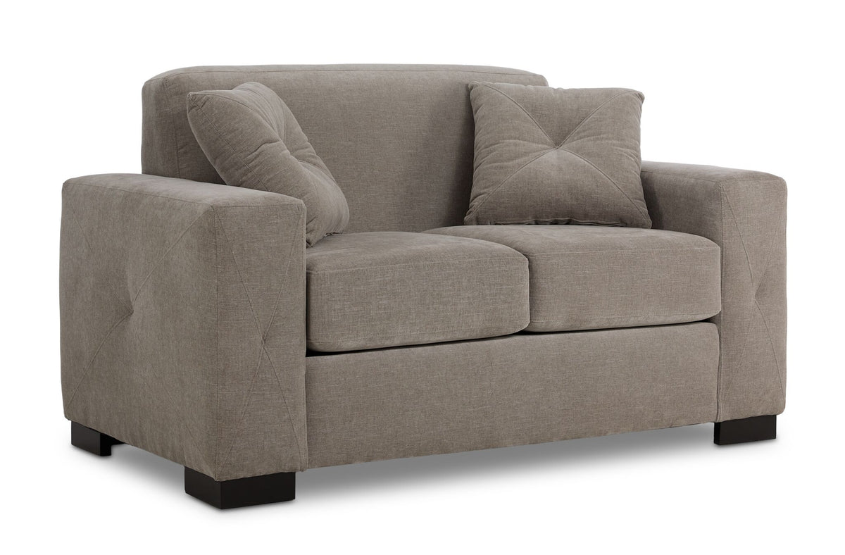 Valetta Loveseat - Wheat angled view with two seat cushions, wide track arms, dark block feet and two accent pillows