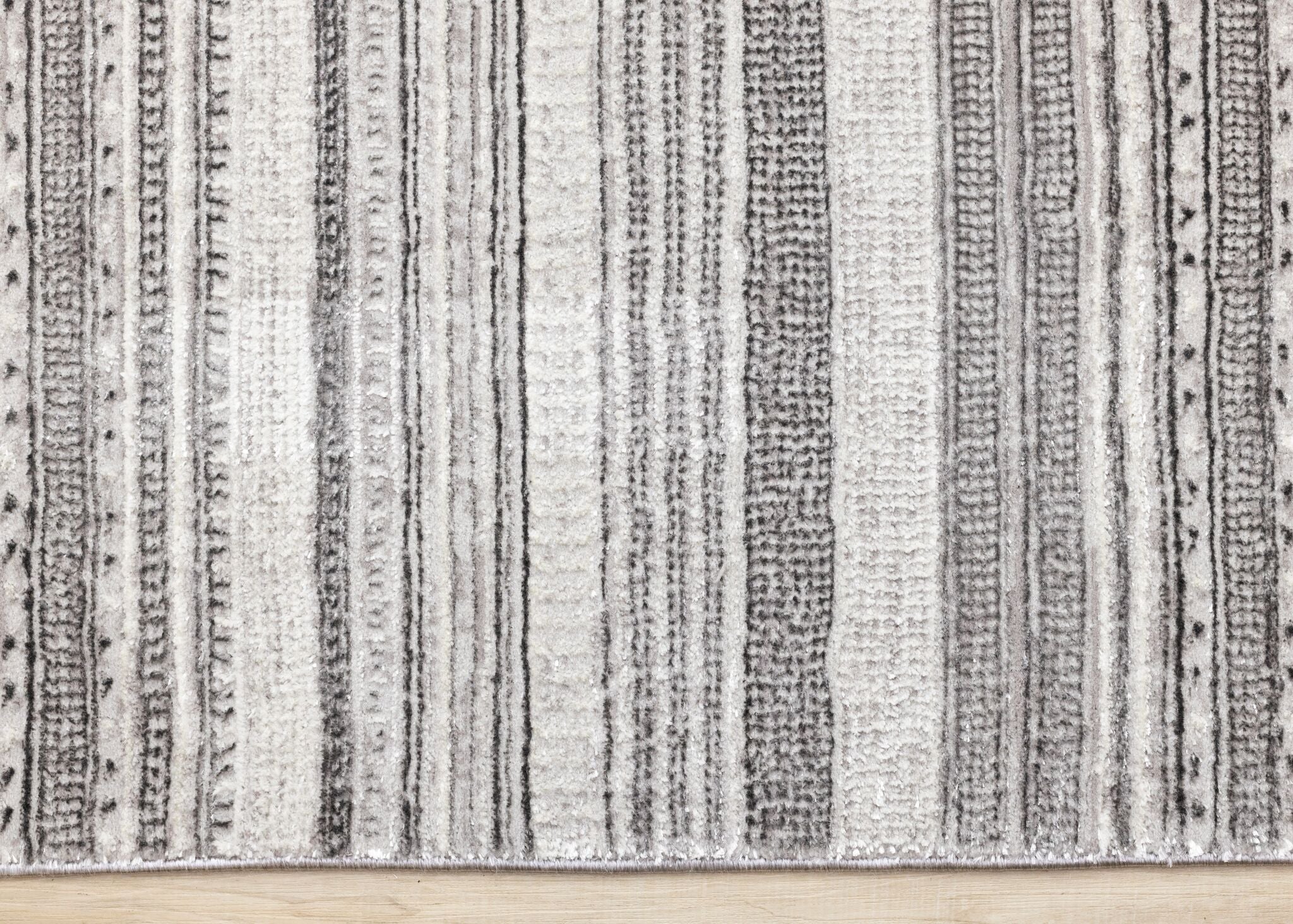 Zola 6'7" x 9'6" Patterned Rows Area Rug - Grey, White, Black