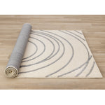 Sully 6'7" x 9'6" Circle Swirl Area Rug - Cream
