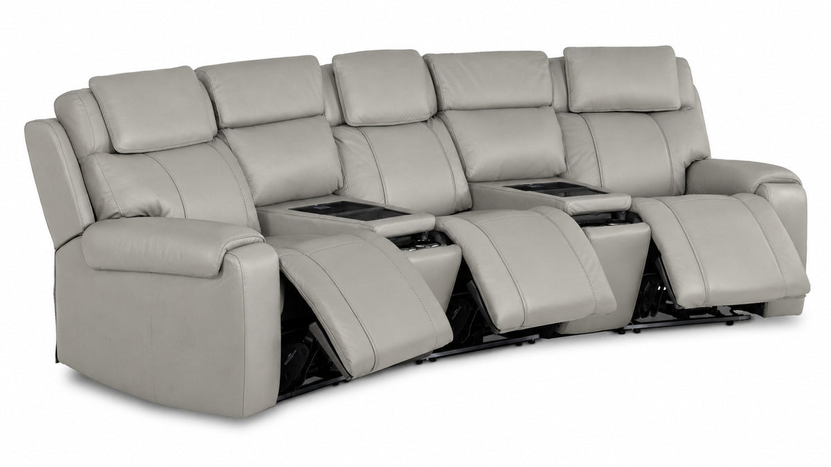 Velocity light grey leather home theatre seating angled view with three extended footrests and two wedge consoles