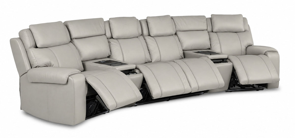 Velocity light grey leather home theatre seating angled view with four power footrests extended and two consoles