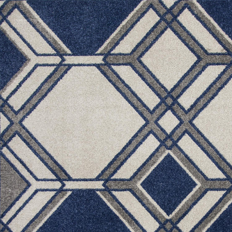Lucious IV 6'7" x 9'6" Ivory/Denim Area Rug Leon's