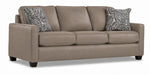 City Leather Sofa - Stone in a three-quarter view with three seat cushions, patterned accent pillows and dark wood legs