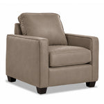 City Leather Chair - Stone in a three-quarter view with a cushioned seat and back, slim track arms and dark wood legs