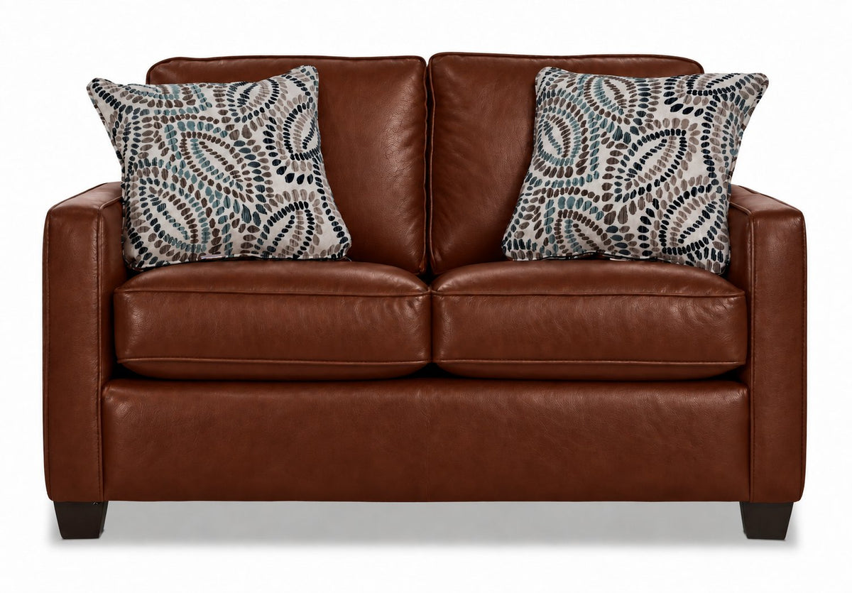 City Leather Loveseat - Brown front view with two seat and back cushions, slim track arms, dark wood legs and two patterned accent pillows