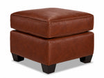 City Leather Ottoman - Brown in a three-quarter view with a thick piped cushion, leather upholstery and dark wood legs