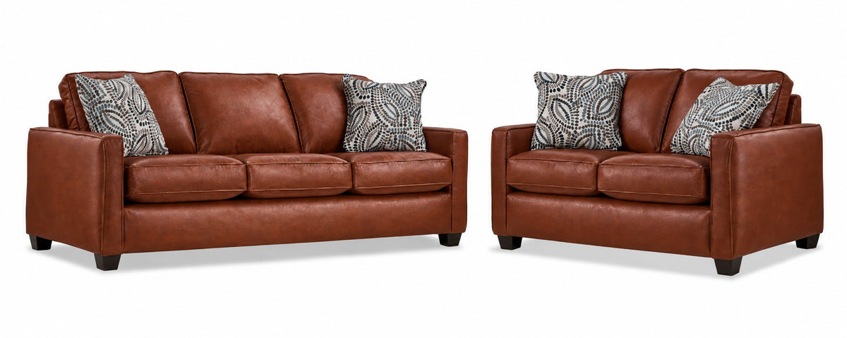City Leather Sofa and Loveseat Set - Brown with matching leather seating, patterned accent pillows and dark wood legs