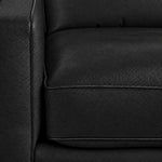 Close-up of the City Leather collection in Black showing textured leather upholstery, piped cushion edges and stitching