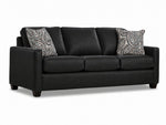 City Leather Sofa - Black in a three-quarter view with three seat cushions, patterned accent pillows and dark wood legs