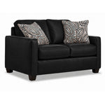 City Leather Loveseat - Black in a three-quarter view with two cushioned seats, slim track arms, dark wood legs and two patterned accent pillows