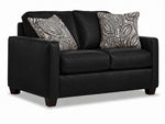 City Leather Loveseat - Black in a three-quarter view with two seat cushions, patterned accent pillows and dark wood legs