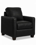 City Leather Chair - Black in a three-quarter view with a box seat cushion, cushioned back and dark wood legs