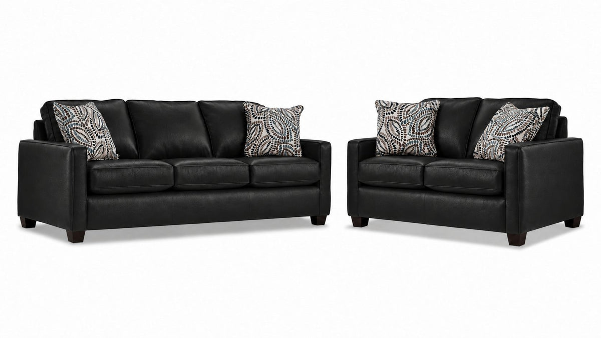 City Leather Sofa and Loveseat Set - Black with matching leather seating, patterned accent pillows and dark wood legs