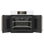 CAFÉ™ Professional Series 30" Matte White French-Door Wall Oven open showing convection fan and two racks