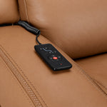 Jackson butternut leather seating close-up showing wired remote for power recline, heat and massage controls
