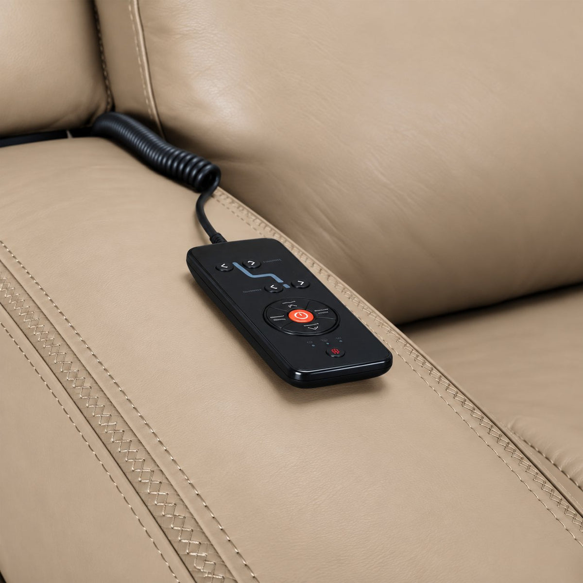 Jackson pristine leather recliner close-up showing wired remote for power recline, heat and massage controls