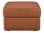 Front view of the cognac leather ottoman with thick padded top and low-profile feet