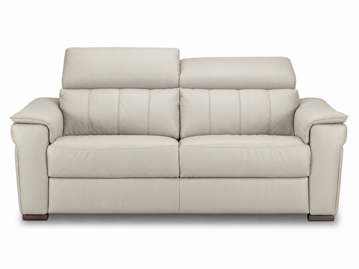 Cream leather sofa with one headrest raised and the other lowered