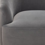 Close-up of Blaire Swivel Accent Chair - Grey showing soft upholstery, curved inner back and stitched seat cushion