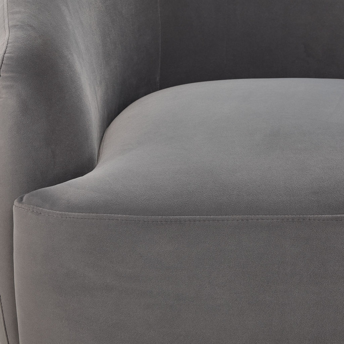 Close-up of Blaire Swivel Accent Chair - Grey showing soft upholstery, curved inner back and stitched seat cushion