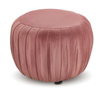 Blaire Ottoman - Blush with a round shape, pleated velvet sides and cushioned top