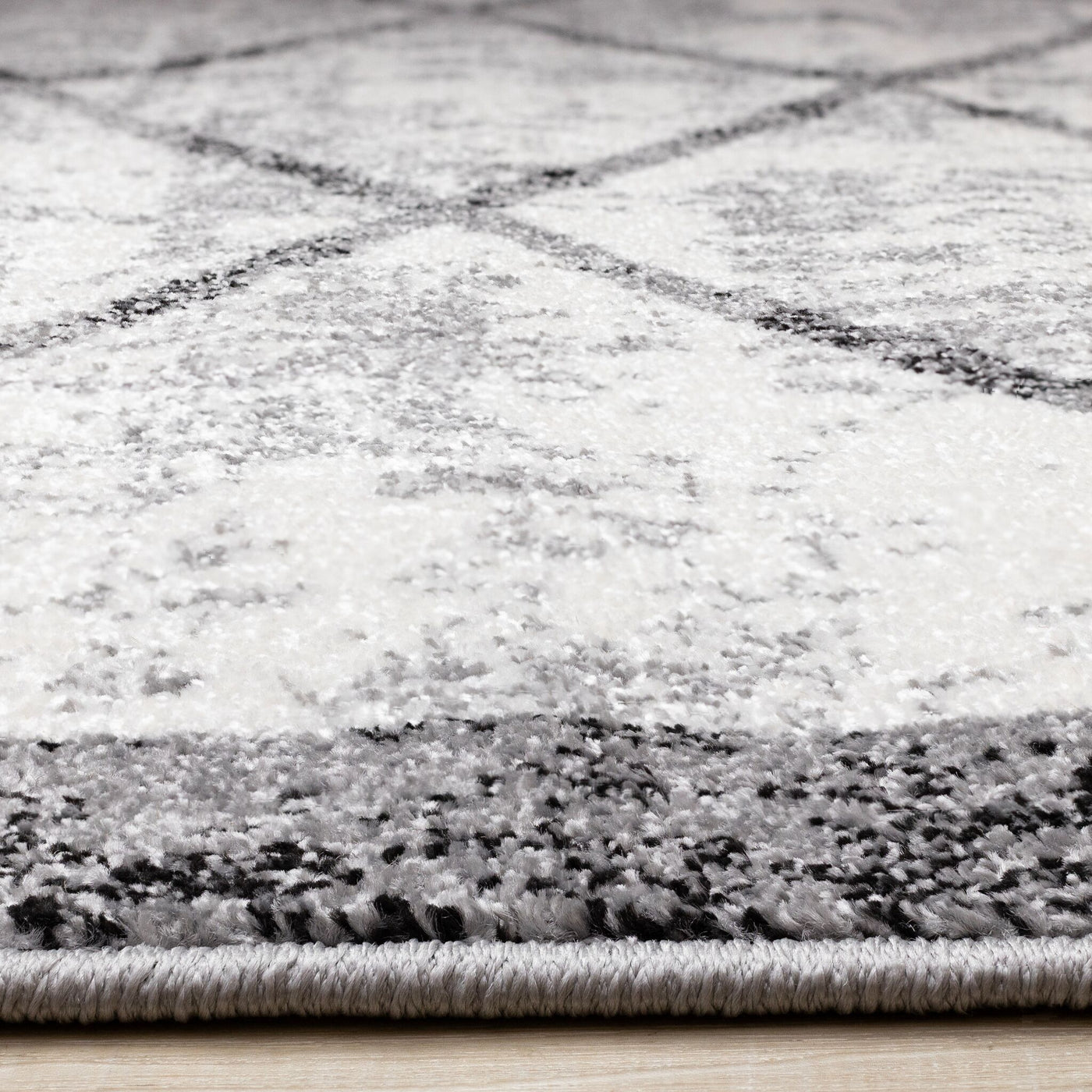 Ashwood 6'7" x 9'10" Distressed Lattice Area Rug - Grey, Black, White