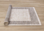 Earthly Essence 6'7" x 9'10" Distressed Border Area Rug - Taupe