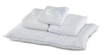 Twin XL 7-Piece White Dream Bedding Bundle with white pillows, folded bedding and sleep mask arranged together