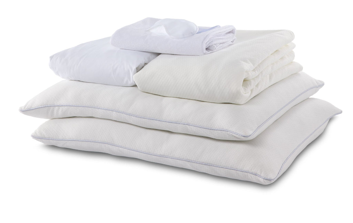 Full 10-Piece Cool Touch White Dream Bedding Bundle with white pillows, folded bedding essentials and sleep mask