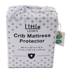 Little Leon’s crib mattress protector in white polka-dot drawstring packaging with 28 x 52 x 9 inch sizing