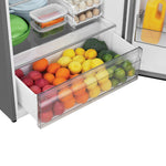 Open produce crisper filled with apples, oranges, lemons, limes and broccoli.