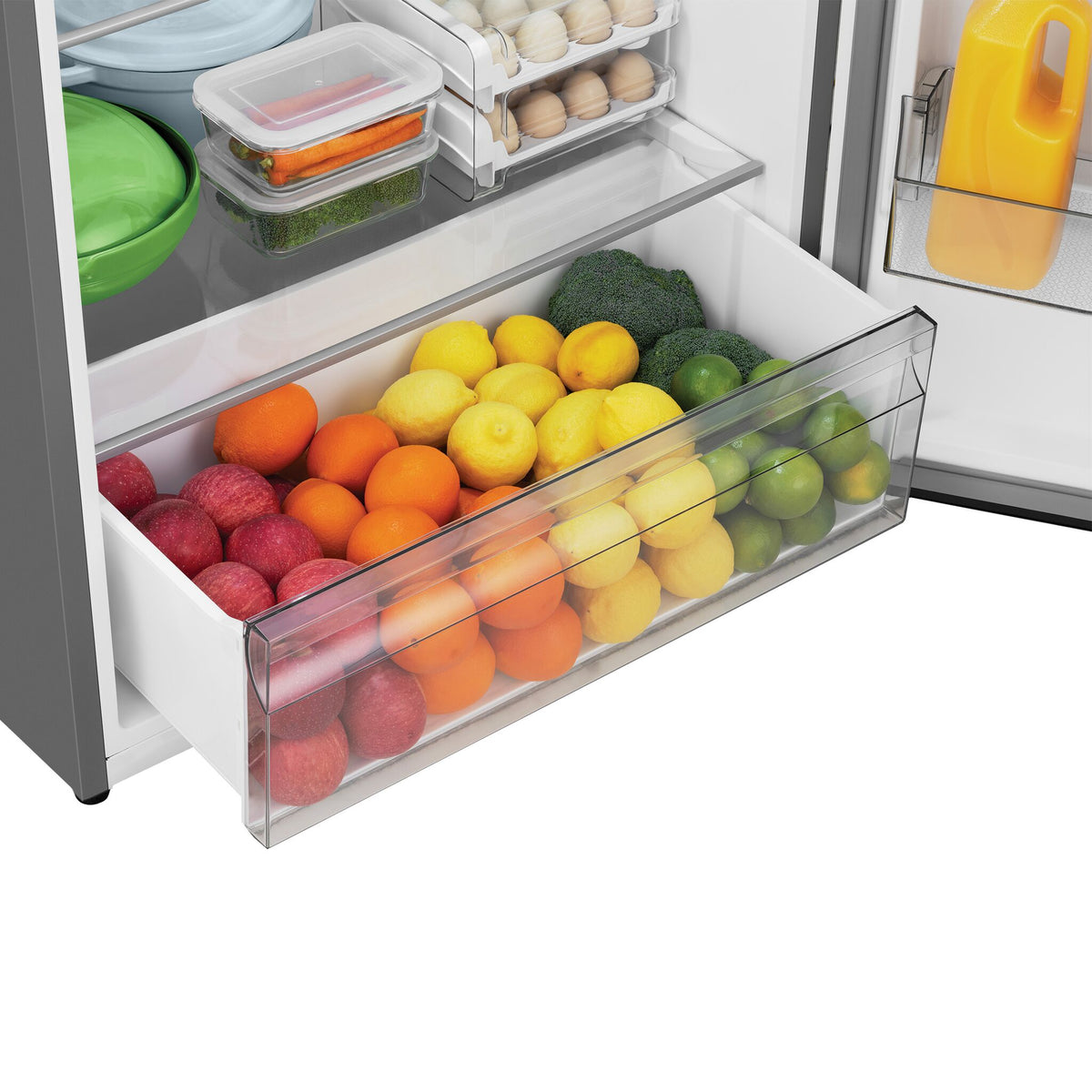 Open produce crisper filled with apples, oranges, lemons, limes and broccoli.