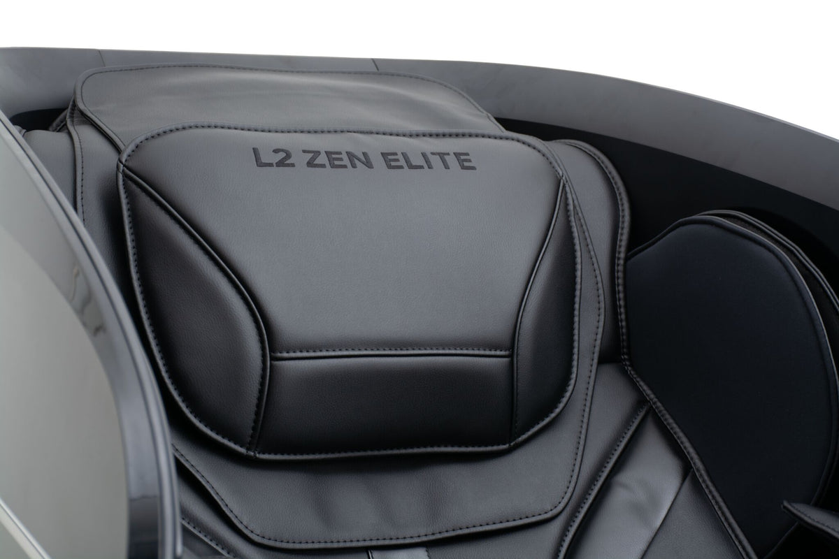 Close-up of the L2 Zen Elite Massage Chair padded headrest with embroidered L2 ZEN ELITE branding
