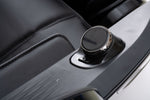 Close-up of the L2 Zen Elite Massage Chair round control dial and adjacent button on the armrest
